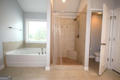 Enter this tranquil retreat that exudes a quiet elegance.  Step on Berkeley Hills Country Club in Georgia - for sale on GolfHomes.com, golf home, golf lot