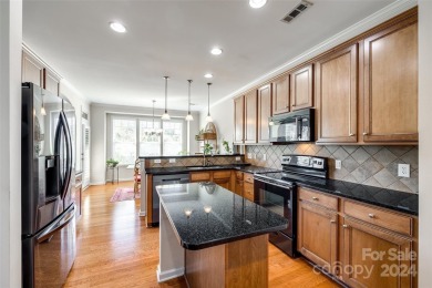 Enjoy the stunning golf course views that this townhome offers on Tega Cay Golf Club in South Carolina - for sale on GolfHomes.com, golf home, golf lot