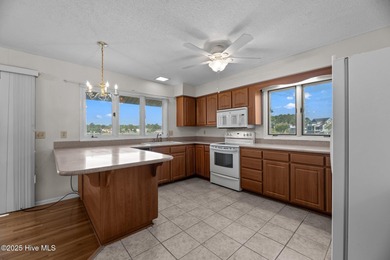 Experience unparalleled waterfront living in this waterfront on Harbour Point Golf Club in North Carolina - for sale on GolfHomes.com, golf home, golf lot