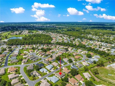 Beautifully updated and modified Granville model boasts on Eagle Ridge At Spruce Creek Country Club in Florida - for sale on GolfHomes.com, golf home, golf lot