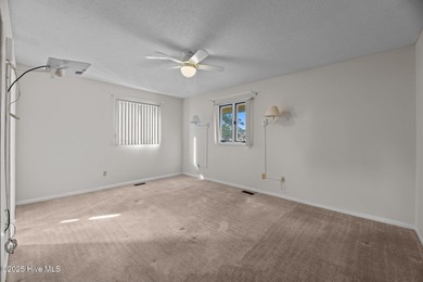 Experience unparalleled waterfront living in this waterfront on Harbour Point Golf Club in North Carolina - for sale on GolfHomes.com, golf home, golf lot