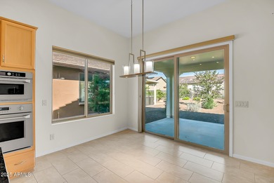 Imagine waking up in a sunlit, stylish space that feels both on Tuscany Falls At Pebble Creek in Arizona - for sale on GolfHomes.com, golf home, golf lot