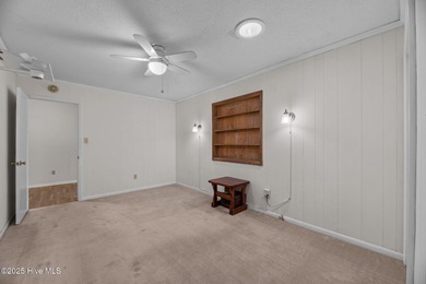 Experience unparalleled waterfront living in this waterfront on Harbour Point Golf Club in North Carolina - for sale on GolfHomes.com, golf home, golf lot