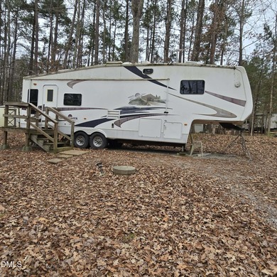 Beautiful camping lot located in the gated Lake Royale on River Golf and Country Club at Lake Royale in North Carolina - for sale on GolfHomes.com, golf home, golf lot