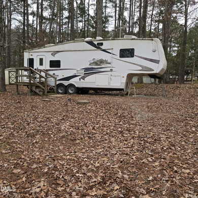 Beautiful camping lot located in the gated Lake Royale on River Golf and Country Club at Lake Royale in North Carolina - for sale on GolfHomes.com, golf home, golf lot