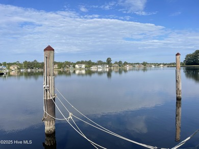 Experience unparalleled waterfront living in this waterfront on Harbour Point Golf Club in North Carolina - for sale on GolfHomes.com, golf home, golf lot