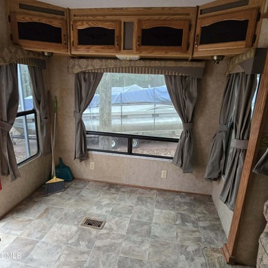 Beautiful camping lot located in the gated Lake Royale on River Golf and Country Club at Lake Royale in North Carolina - for sale on GolfHomes.com, golf home, golf lot