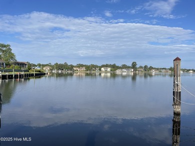 Experience unparalleled waterfront living in this waterfront on Harbour Point Golf Club in North Carolina - for sale on GolfHomes.com, golf home, golf lot