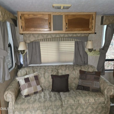 Beautiful camping lot located in the gated Lake Royale on River Golf and Country Club at Lake Royale in North Carolina - for sale on GolfHomes.com, golf home, golf lot