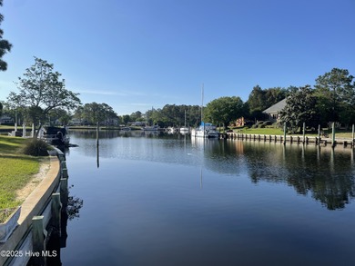 Experience unparalleled waterfront living in this waterfront on Harbour Point Golf Club in North Carolina - for sale on GolfHomes.com, golf home, golf lot