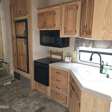 Beautiful camping lot located in the gated Lake Royale on River Golf and Country Club at Lake Royale in North Carolina - for sale on GolfHomes.com, golf home, golf lot