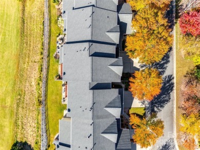 Enjoy the stunning golf course views that this townhome offers on Tega Cay Golf Club in South Carolina - for sale on GolfHomes.com, golf home, golf lot