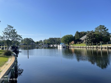 Experience unparalleled waterfront living in this waterfront on Harbour Point Golf Club in North Carolina - for sale on GolfHomes.com, golf home, golf lot