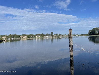 Experience unparalleled waterfront living in this waterfront on Harbour Point Golf Club in North Carolina - for sale on GolfHomes.com, golf home, golf lot