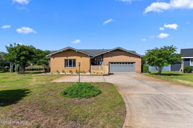 Experience unparalleled waterfront living in this waterfront on Harbour Point Golf Club in North Carolina - for sale on GolfHomes.com, golf home, golf lot