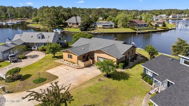 Experience unparalleled waterfront living in this waterfront on Harbour Point Golf Club in North Carolina - for sale on GolfHomes.com, golf home, golf lot