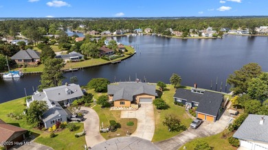 Experience unparalleled waterfront living in this waterfront on Harbour Point Golf Club in North Carolina - for sale on GolfHomes.com, golf home, golf lot