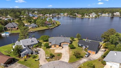 Experience unparalleled waterfront living in this waterfront on Harbour Point Golf Club in North Carolina - for sale on GolfHomes.com, golf home, golf lot