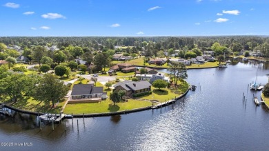 Experience unparalleled waterfront living in this waterfront on Harbour Point Golf Club in North Carolina - for sale on GolfHomes.com, golf home, golf lot