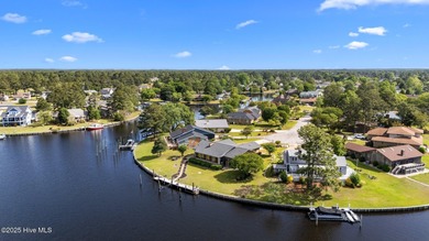 Experience unparalleled waterfront living in this waterfront on Harbour Point Golf Club in North Carolina - for sale on GolfHomes.com, golf home, golf lot