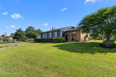 Experience unparalleled waterfront living in this waterfront on Harbour Point Golf Club in North Carolina - for sale on GolfHomes.com, golf home, golf lot