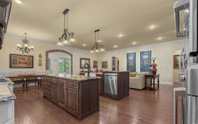 Stunning all-brick and stone lakefront home on Lake Granada in on Granada Golf Course in Arkansas - for sale on GolfHomes.com, golf home, golf lot