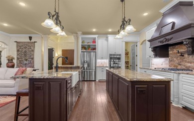 Stunning all-brick and stone lakefront home on Lake Granada in on Granada Golf Course in Arkansas - for sale on GolfHomes.com, golf home, golf lot
