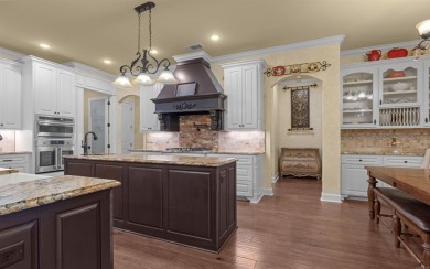 Stunning all-brick and stone lakefront home on Lake Granada in on Granada Golf Course in Arkansas - for sale on GolfHomes.com, golf home, golf lot