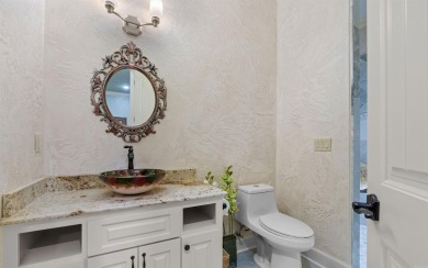 Stunning all-brick and stone lakefront home on Lake Granada in on Granada Golf Course in Arkansas - for sale on GolfHomes.com, golf home, golf lot