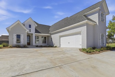 Stunning new construction in the best location possible: Lake on Lake Caroline Golf Club in Mississippi - for sale on GolfHomes.com, golf home, golf lot