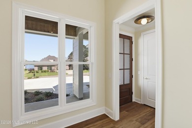 Stunning new construction in the best location possible: Lake on Lake Caroline Golf Club in Mississippi - for sale on GolfHomes.com, golf home, golf lot