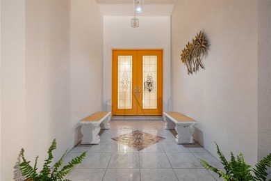 Low-maintenance, country club home with a private setting! Over on Boca Royale Golf and Country Club in Florida - for sale on GolfHomes.com, golf home, golf lot