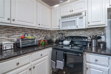 Charming and low-maintenance, this all-brick two-story home is on Jennings Mill Country Club in Georgia - for sale on GolfHomes.com, golf home, golf lot