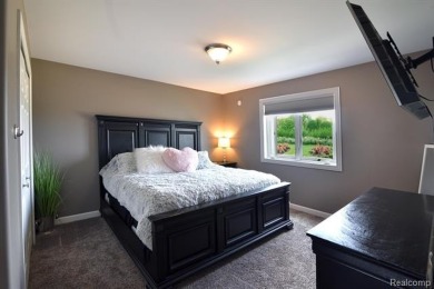 Welcome to this exceptional 4-bedroom, 2.5-bath custom home on Copper Ridge Golf Club in Michigan - for sale on GolfHomes.com, golf home, golf lot