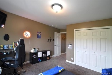 Welcome to this exceptional 4-bedroom, 2.5-bath custom home on Copper Ridge Golf Club in Michigan - for sale on GolfHomes.com, golf home, golf lot