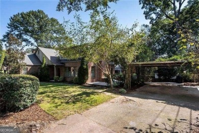 This meticulously maintained Tudor idyllically located in on Druid Hills Golf Club in Georgia - for sale on GolfHomes.com, golf home, golf lot