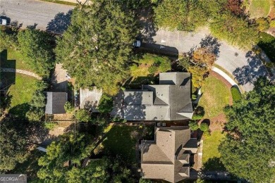 This meticulously maintained Tudor idyllically located in on Druid Hills Golf Club in Georgia - for sale on GolfHomes.com, golf home, golf lot