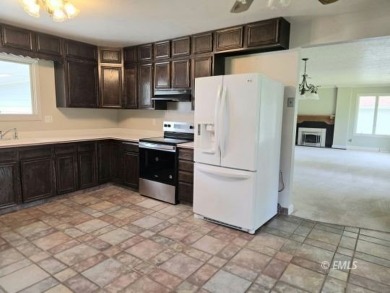 Nestled in the Country Club Estates, this charming ranch-style on Miles City Town and Country Club in Montana - for sale on GolfHomes.com, golf home, golf lot