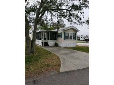 This charming 1 bedroom, 1 bathroom manufactured home in St on Marsh Valley Country Club in Florida - for sale on GolfHomes.com, golf home, golf lot