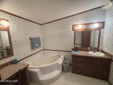 Just over an acre in Lake Tansi!! This large split floor plan on Lake Tansi Village Country Club in Tennessee - for sale on GolfHomes.com, golf home, golf lot