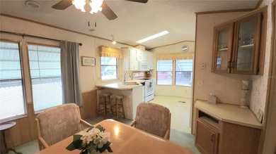TURNKEY MOBILE HOME IN ACTIVE 55+ COMMUNITY! This one bedroom, 1 on River Run Golf Links in Florida - for sale on GolfHomes.com, golf home, golf lot