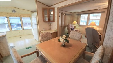 TURNKEY MOBILE HOME IN ACTIVE 55+ COMMUNITY! This one bedroom, 1 on River Run Golf Links in Florida - for sale on GolfHomes.com, golf home, golf lot