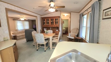 TURNKEY MOBILE HOME IN ACTIVE 55+ COMMUNITY! This one bedroom, 1 on River Run Golf Links in Florida - for sale on GolfHomes.com, golf home, golf lot