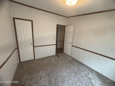 Just over an acre in Lake Tansi!! This large split floor plan on Lake Tansi Village Country Club in Tennessee - for sale on GolfHomes.com, golf home, golf lot