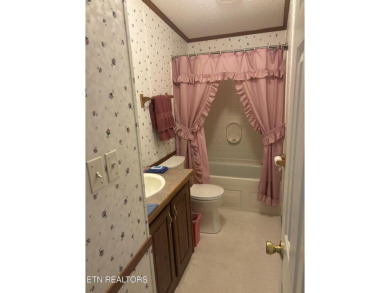 Just over an acre in Lake Tansi!! This large split floor plan on Lake Tansi Village Country Club in Tennessee - for sale on GolfHomes.com, golf home, golf lot