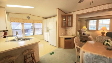 TURNKEY MOBILE HOME IN ACTIVE 55+ COMMUNITY! This one bedroom, 1 on River Run Golf Links in Florida - for sale on GolfHomes.com, golf home, golf lot