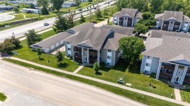 Enjoy top-floor privacy and peaceful views from this pristine on Quail Creek Golf Course in Iowa - for sale on GolfHomes.com, golf home, golf lot