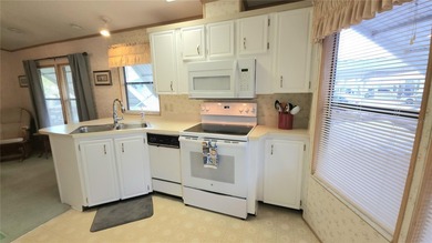 TURNKEY MOBILE HOME IN ACTIVE 55+ COMMUNITY! This one bedroom, 1 on River Run Golf Links in Florida - for sale on GolfHomes.com, golf home, golf lot