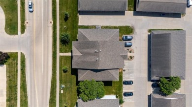 Enjoy top-floor privacy and peaceful views from this pristine on Quail Creek Golf Course in Iowa - for sale on GolfHomes.com, golf home, golf lot