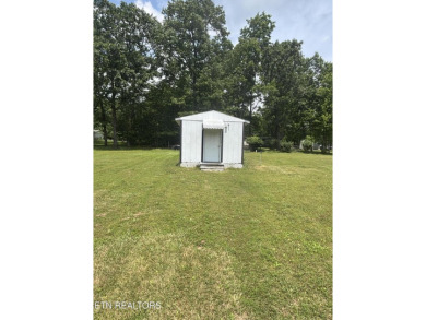 Just over an acre in Lake Tansi!! This large split floor plan on Lake Tansi Village Country Club in Tennessee - for sale on GolfHomes.com, golf home, golf lot